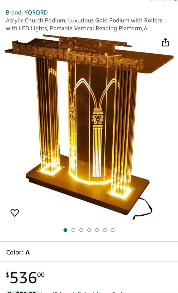A gold lectern with bright white lights glowing around it.