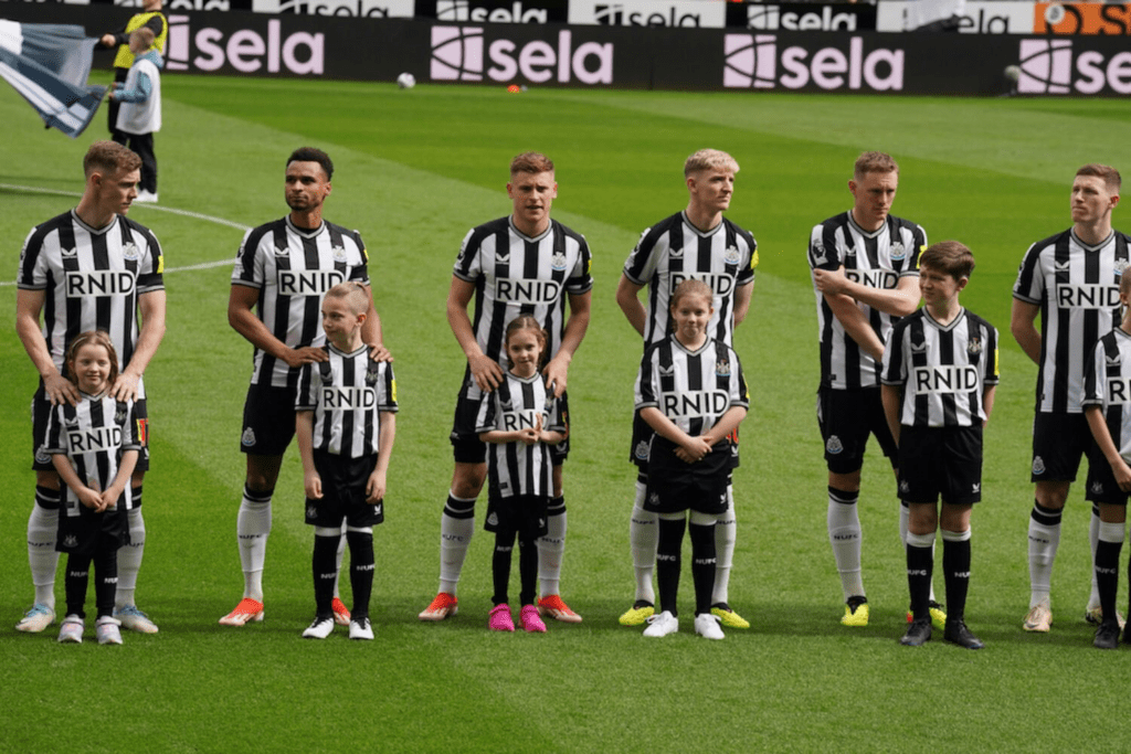 The newcastle united shirts in action on match day.