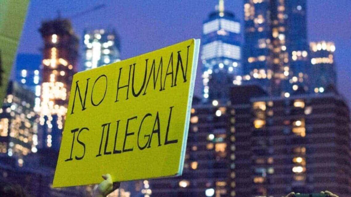 Teen Immigrant’s Release Propels Lawsuit Against Ice To End Courthouse Arrests Immigration and daca protections protest sign that says no human is illegal