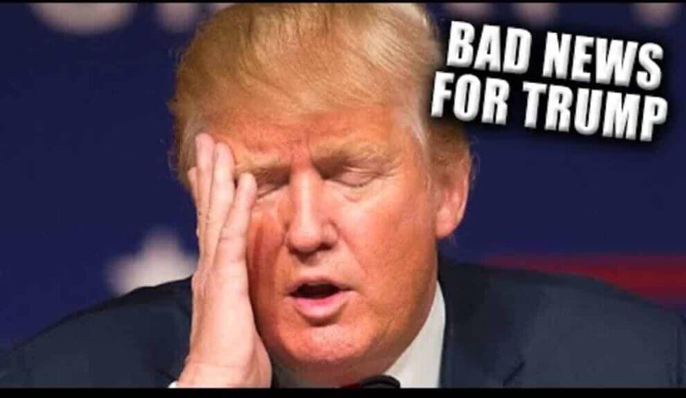 Donald trump with his head in his hand, eyes closed