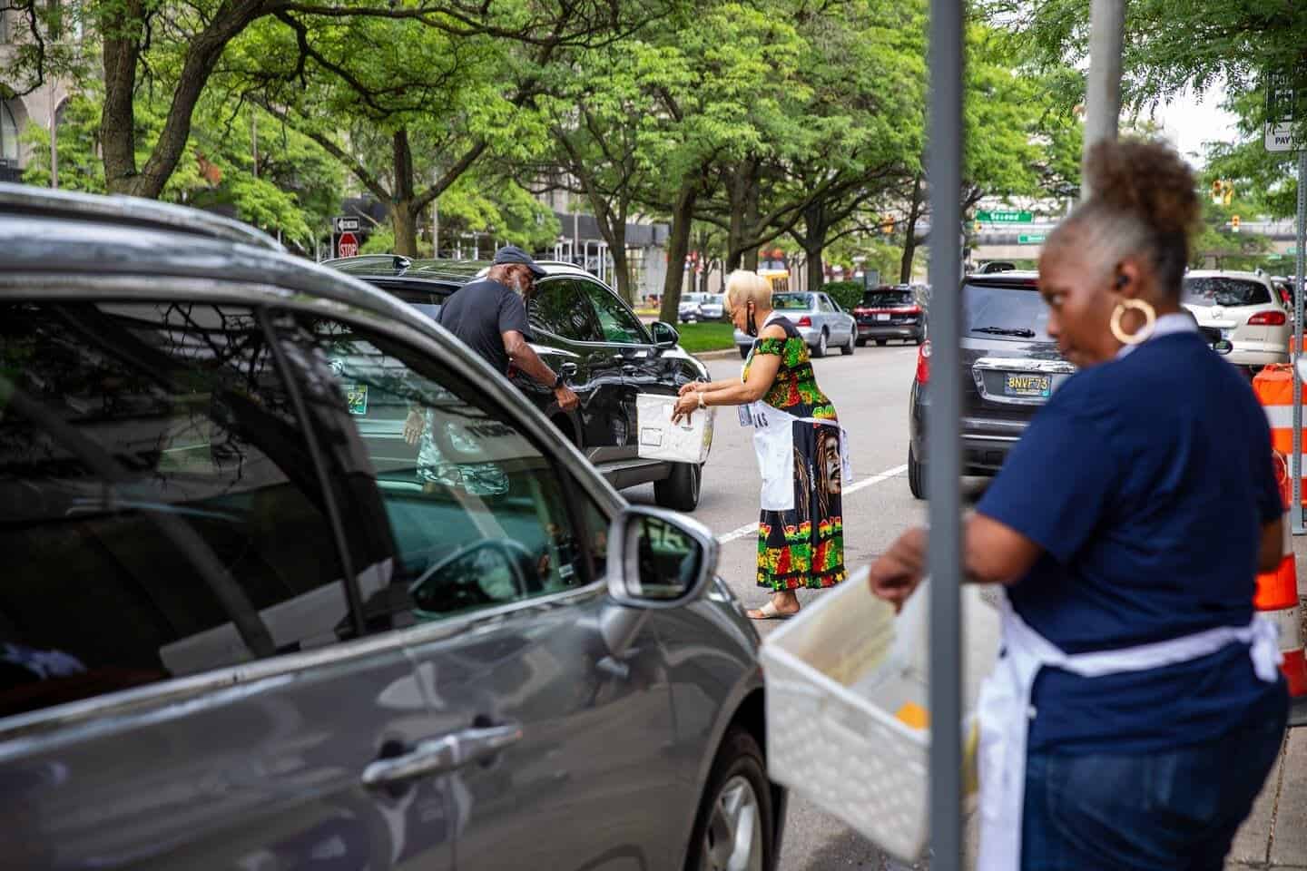Michigan votes election workers collect absentee ballots from voters during early voting for the august primary in detroit on july 29, 2024.