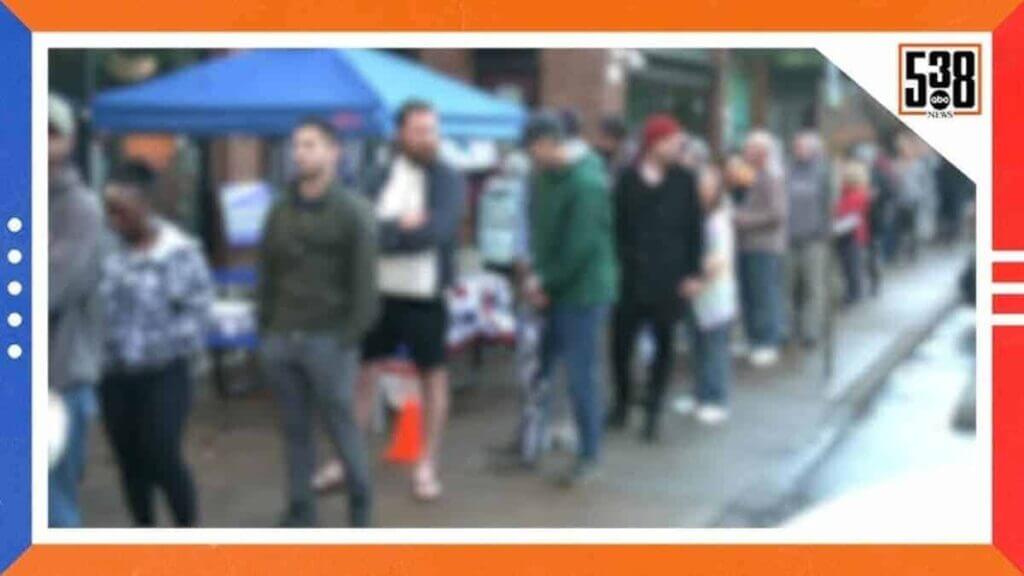 Blurry photo of people waiting in line to vote