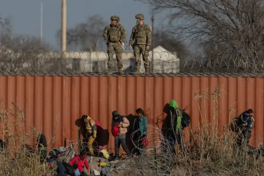 Immigrants at the border wall