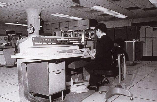 Census-bureau-employee Census executive order. Census bureau employee working on the computer they used in the 60’s.