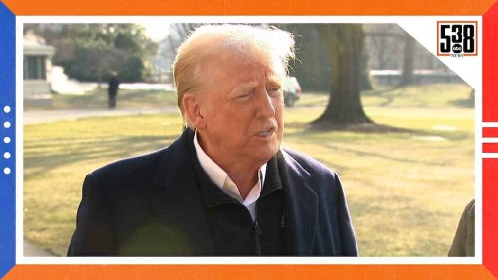 Donald trump speaking to a reporter outdoors