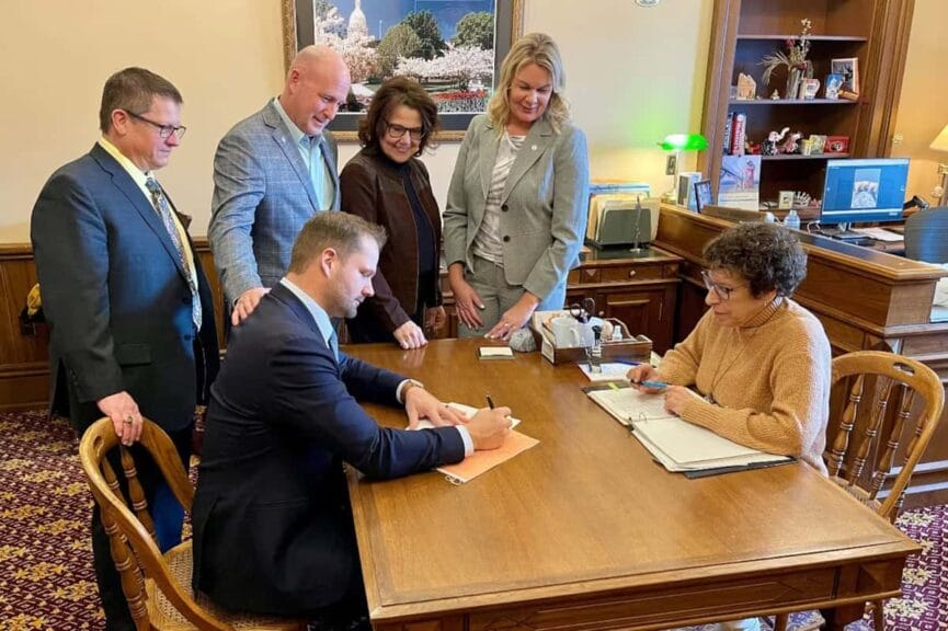 Co-sponsors of michigan legislation to require proof-of-citizenship for voting look on as state rep. Bryan posthumus submits the bill to the clerk. The co-sponsors are, from left, reps. Brian begole, jay deboyer, ann bollin, and rachelle smit. Smit, bollin, and deboyer are former election clerks.