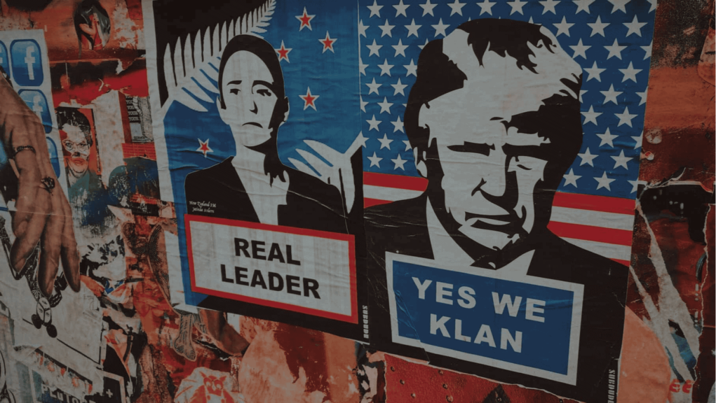 Posters and graffiti on a building in mexico. Posters feature mexican and u. S. Leaders. Mexican president’s poster says real leader. Donald trump poster sats yes we klan