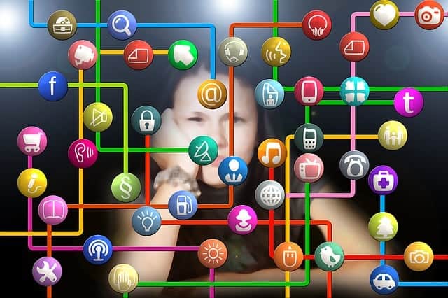 Teen-sad-social How children and teens use social media affects them emotionally. Sad teen girl with social media logos in front of her