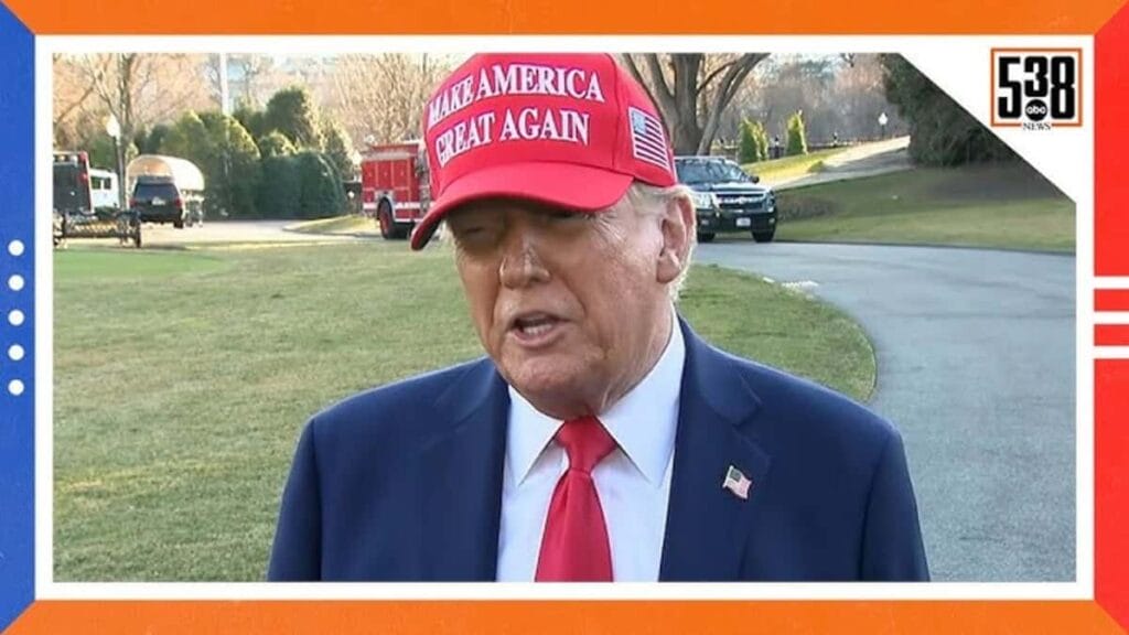 Donald trump wearing a maga hat