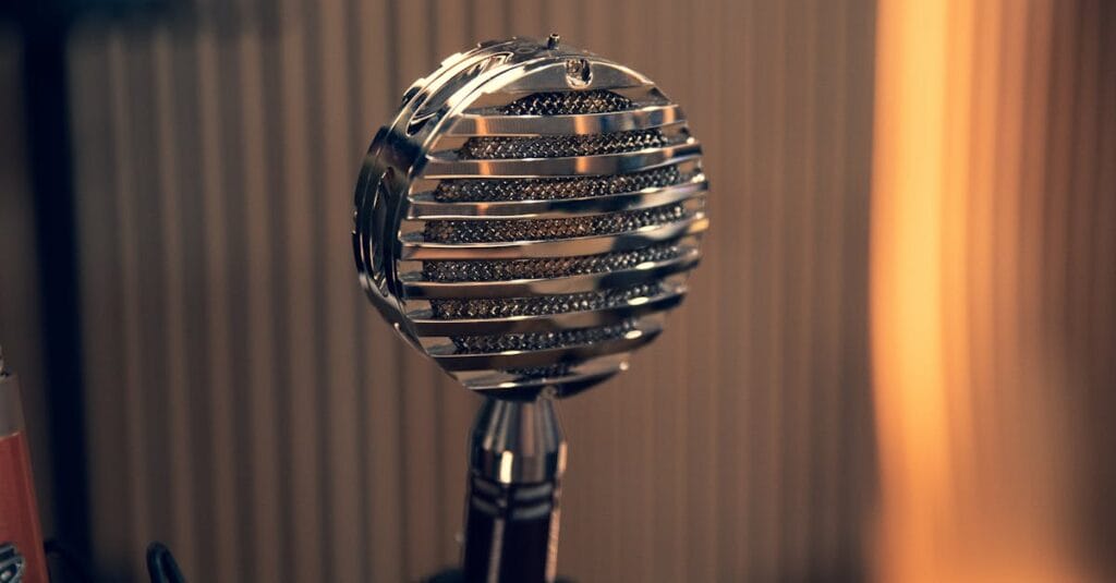 Close-up of a vintage microphone with a striped background in a studio environment.