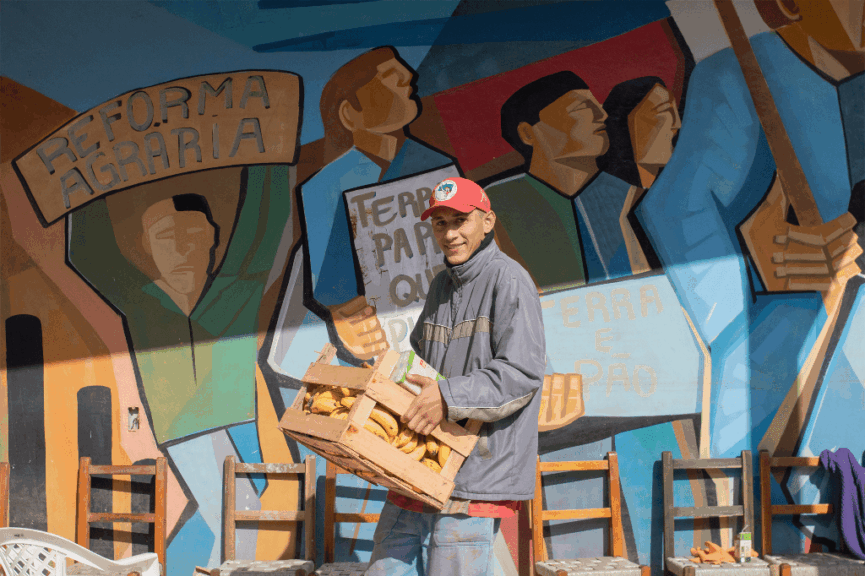 Man carrying a crate of bananas