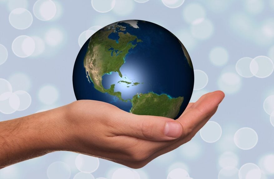 Global south, a hand holding the planet