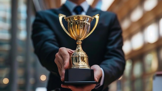 The Art Of Nodding While Internally Screaming: Dealing With Climate Change Denialists Trophy being handed to the reader signifying an award for best climate change denialists