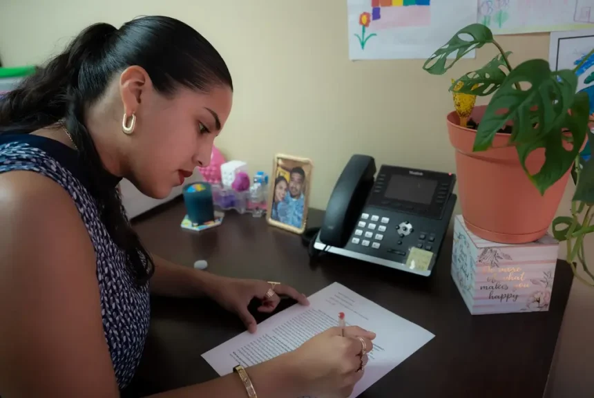 Texas Colleges Scramble To Comply With Ban On In-State Tuition For Undocumented Students Katerin edits her schoolwork in her houston office on aug. 17, 2025. She works full-time as a case worker while also balancing a masters program in social work.