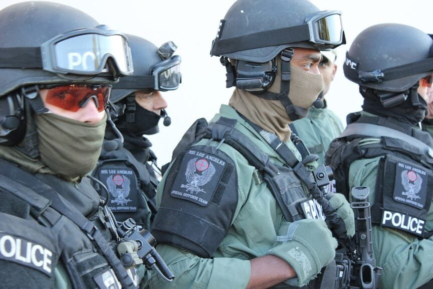 Men impersonating ice agents with their faces covered