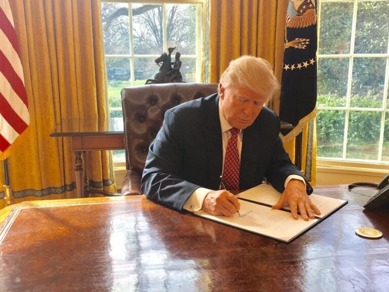 Trump signing an executive order